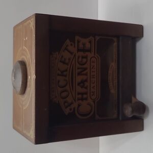 Vintage wooden coin bank with stopper